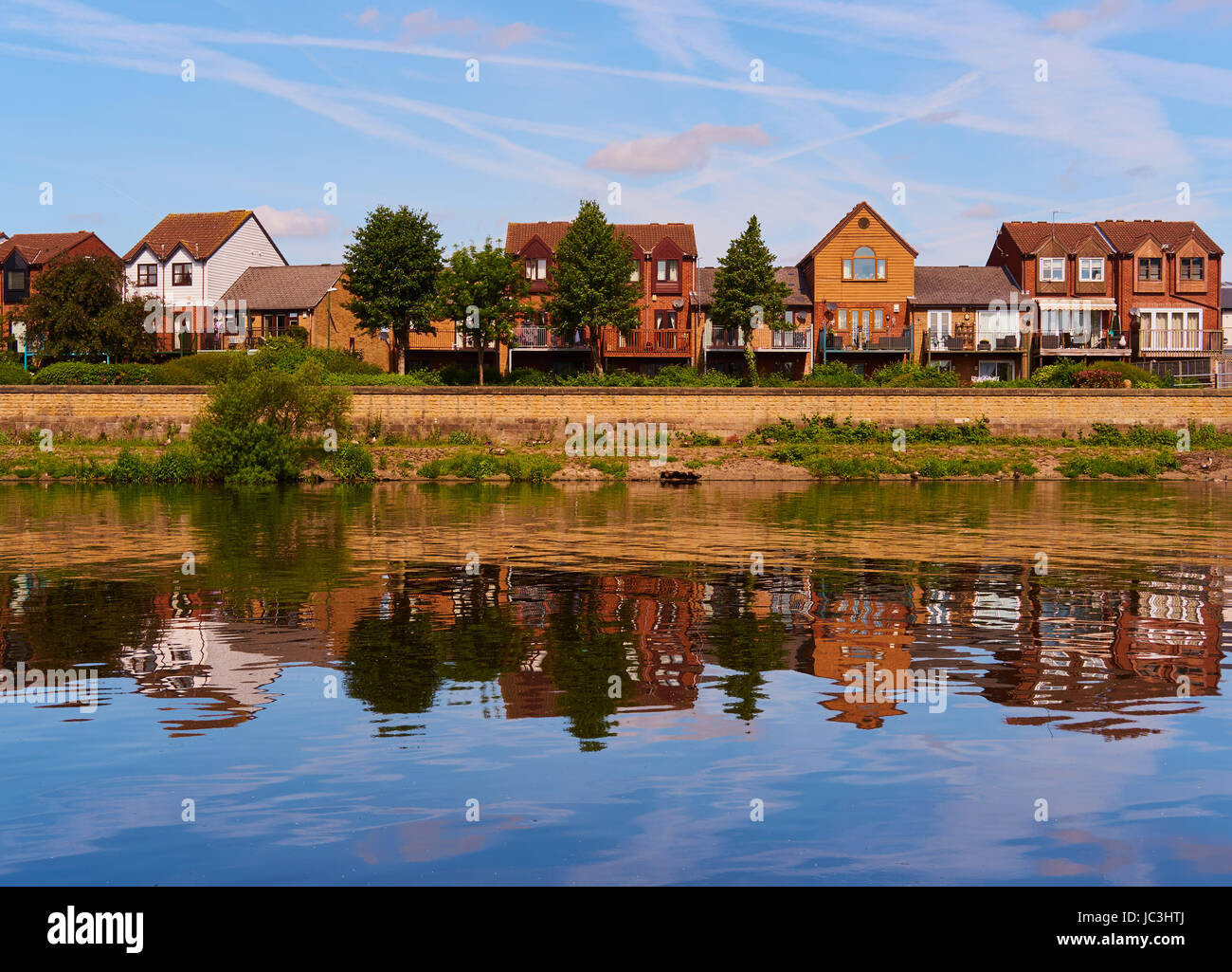 Riverside properties reflected in river Trent, Nottingham