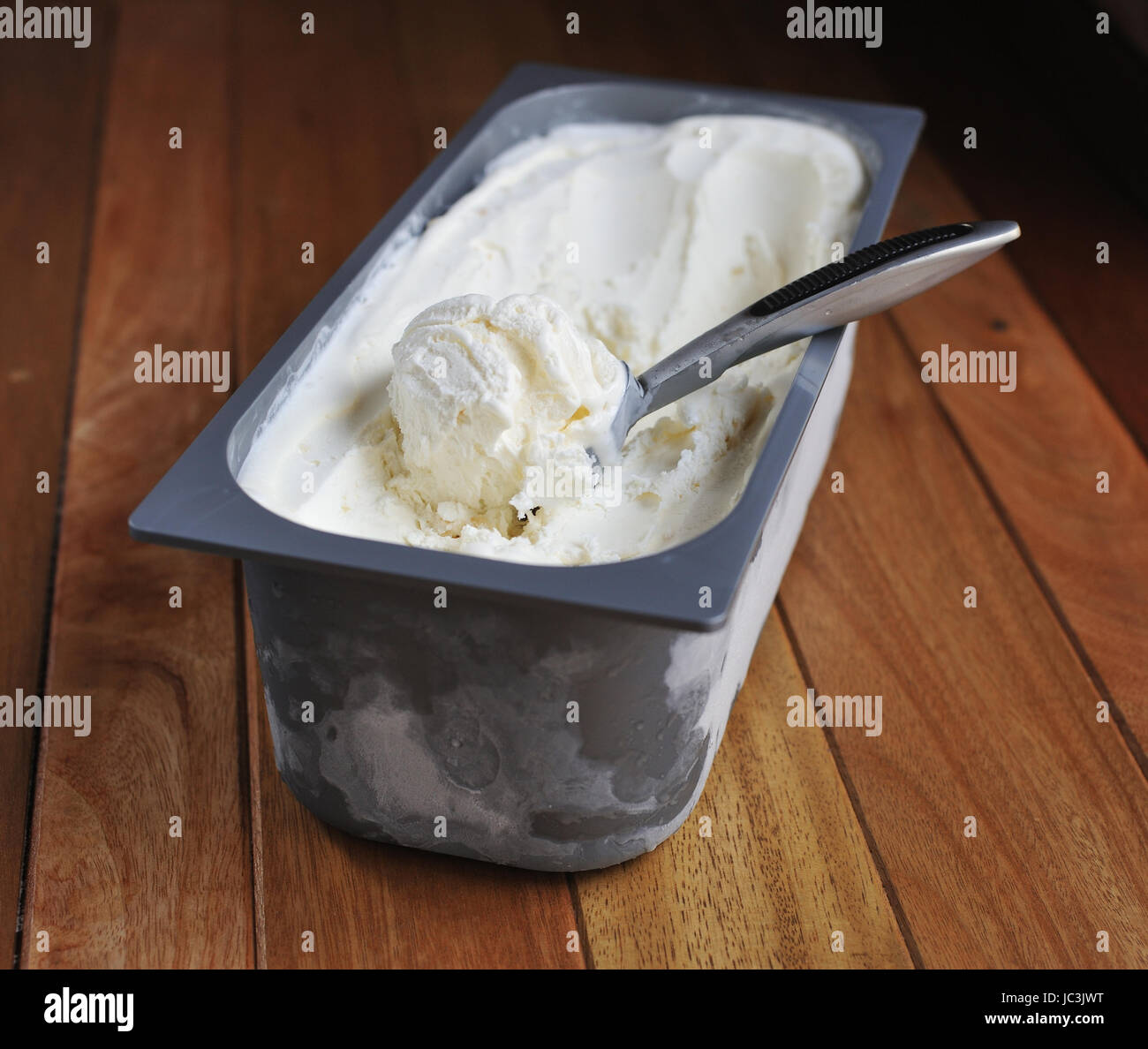 Homemade Organic Vanilla ice cream scoop, scooped out of a container