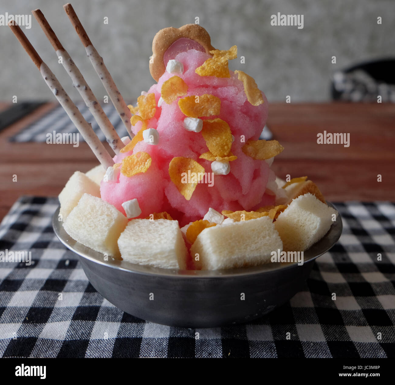 Shaved ice with syrup and milk, chocolate, strawberry Stock Photo Alamy