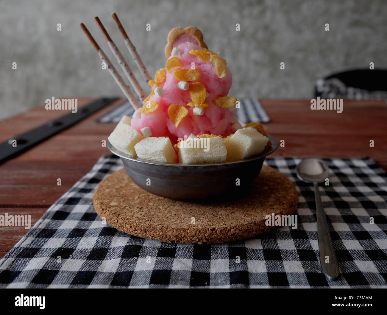 Shaved ice with syrup and milk, chocolate, strawberry Stock Photo Alamy