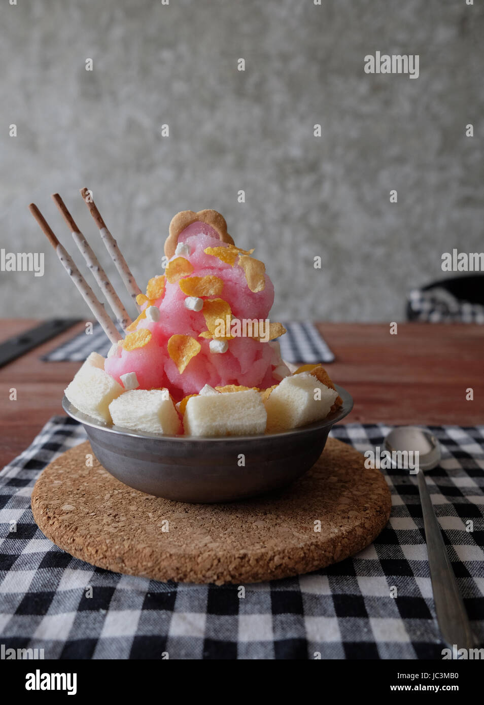Shaved ice with syrup and milk, chocolate, strawberry Stock Photo Alamy