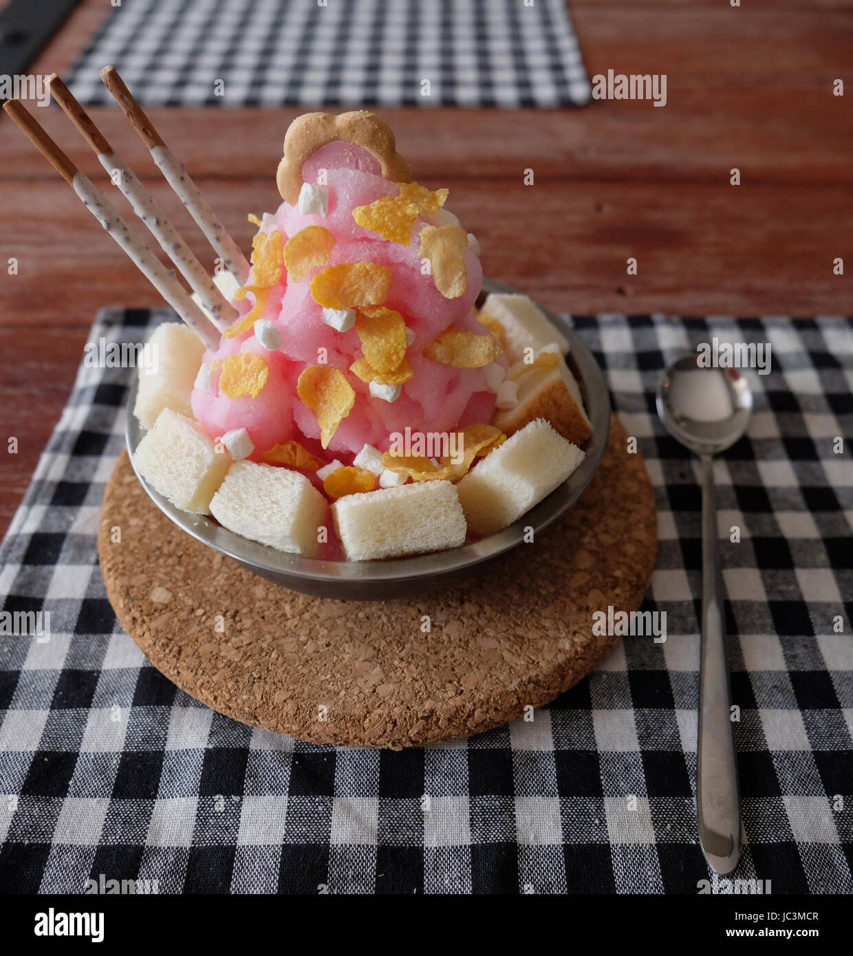 Shaved ice with syrup and milk, chocolate, strawberry Stock Photo Alamy