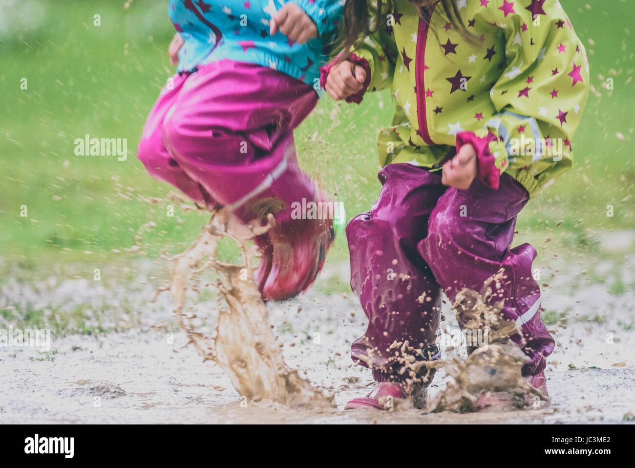 Girl jumping in puddle hires stock photography and images Alamy