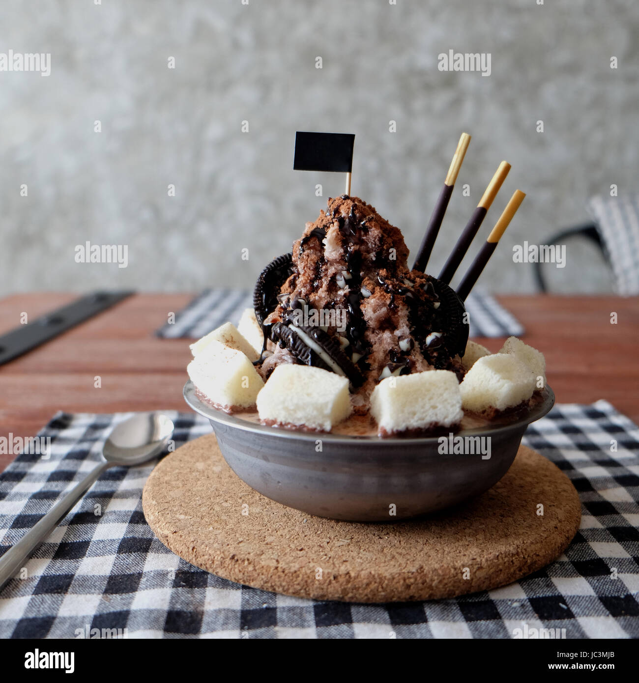 Shaved ice with syrup and milk, chocolate, strawberry Stock Photo Alamy