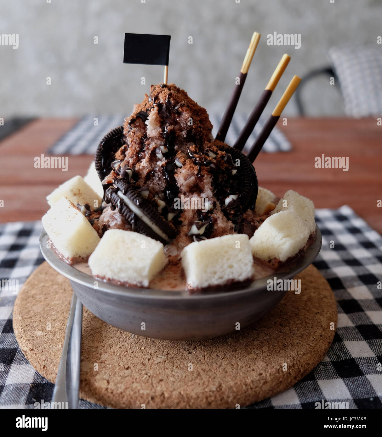 Shaved ice with syrup and milk, chocolate, strawberry Stock Photo Alamy