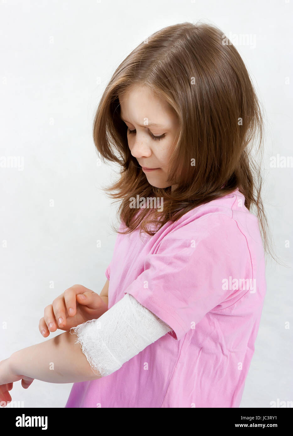 Childhood trauma. A child with a bandage tied hand Stock Photo Alamy