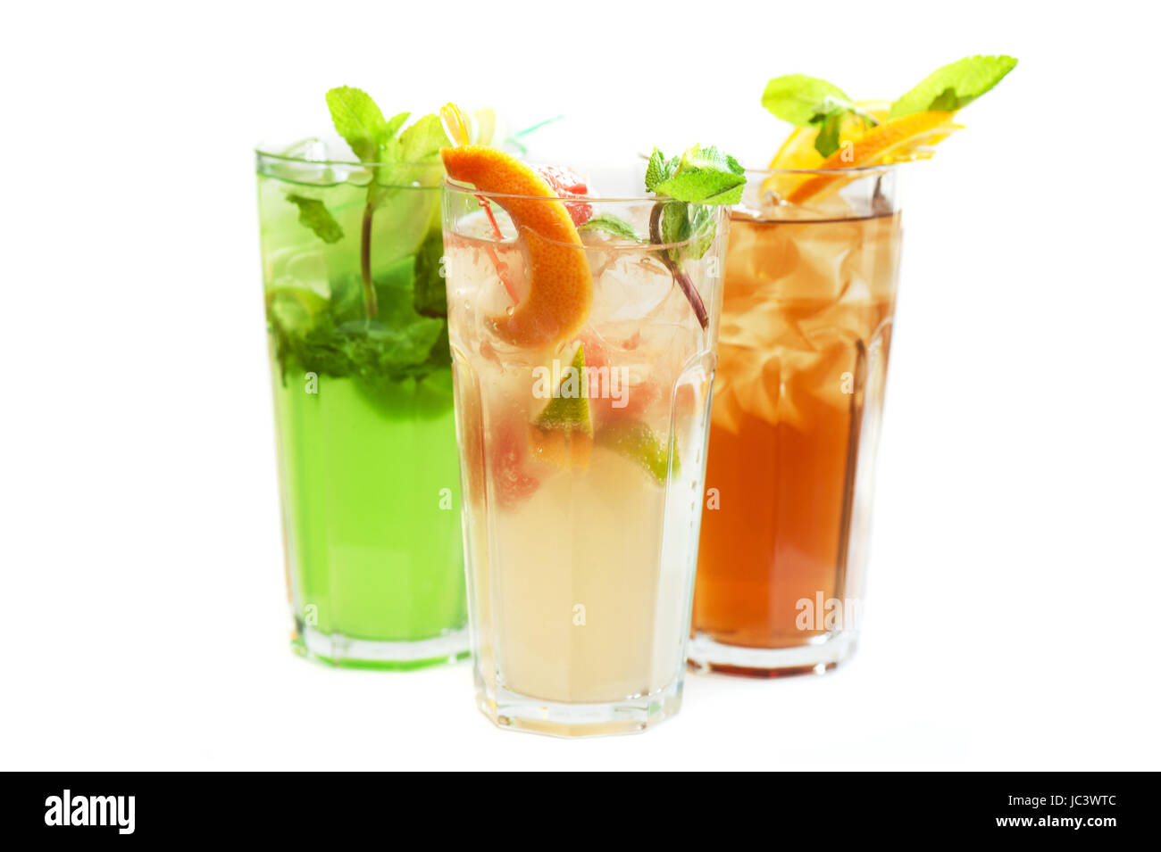 Set of fresh cold tea with fruits, berries and ice on white Stock Photo ...