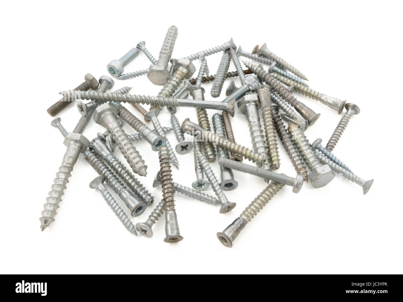 Mixed pile of screws and bolts of different sizes and kinds, isolated on a white background Stock Photo