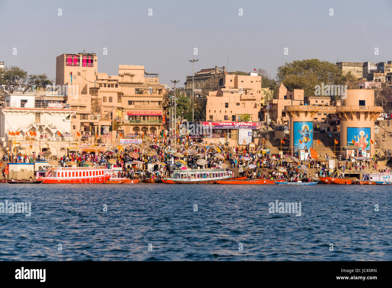 View across the holy river Ganges on Dashashwamedh Ghat, Main Ghat, in the suburb Godowlia Stock Photo