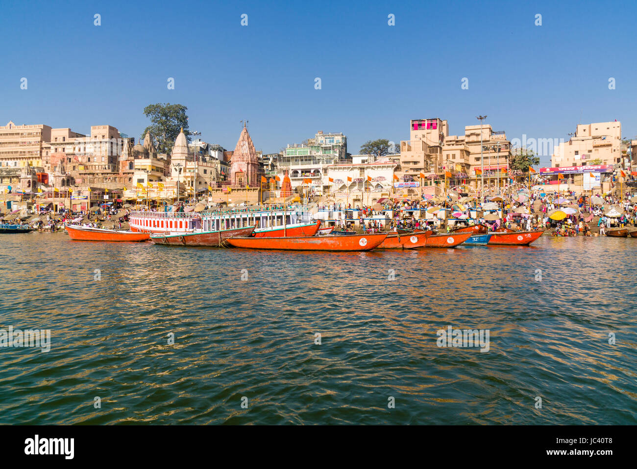 View across the holy river Ganges on Dashashwamedh Ghat, Main Ghat, in the suburb Godowlia Stock Photo