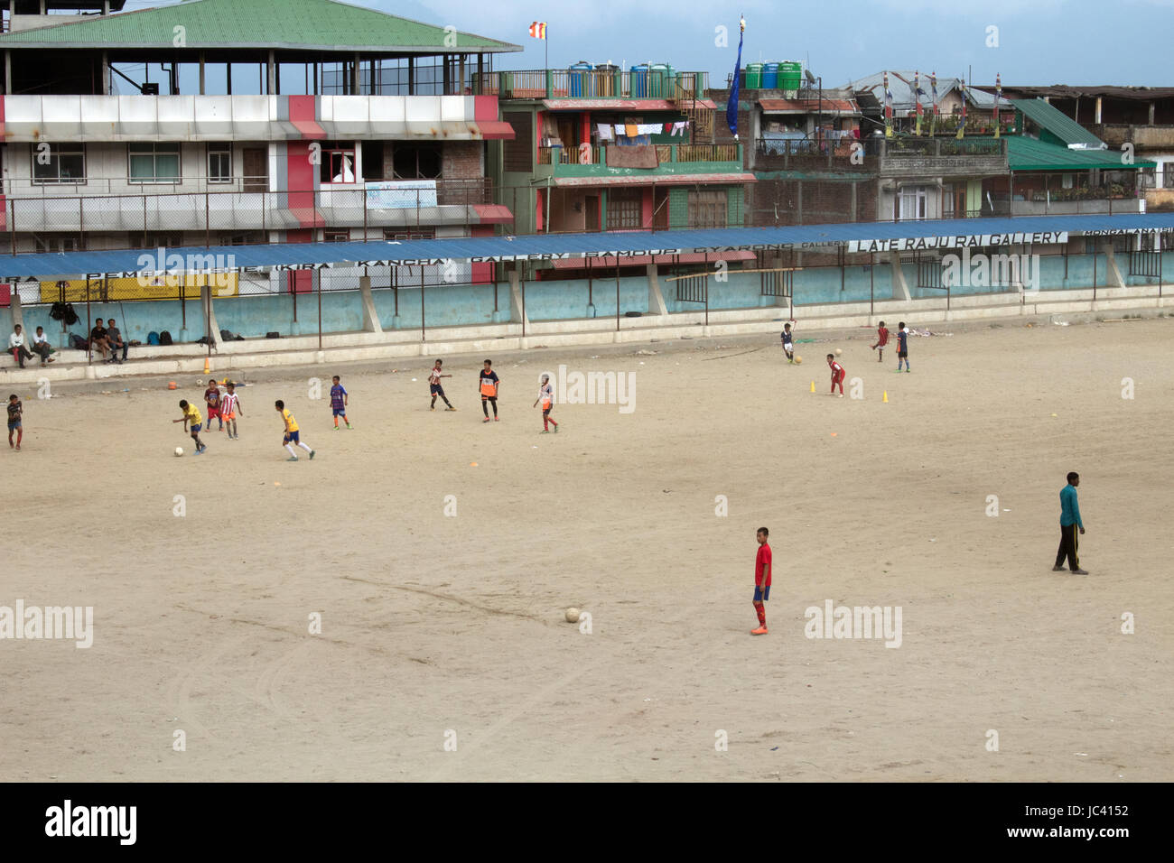 Locals playing cricket and football in the Kalimpong Mela Ground a sport stadium, arena Kalimpong West Bengal India Stock Photo