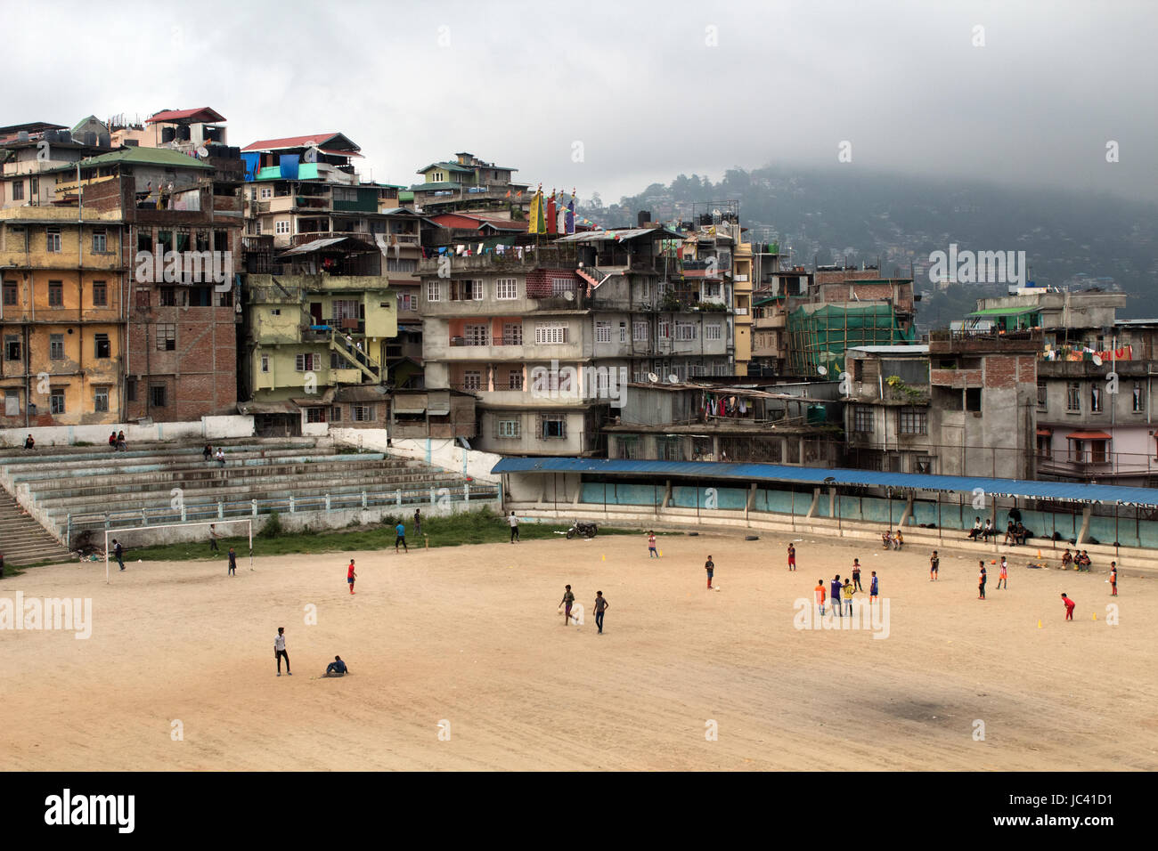 Locals playing cricket and football in the Kalimpong Mela Ground a sport stadium, arena Kalimpong West Bengal India Stock Photo