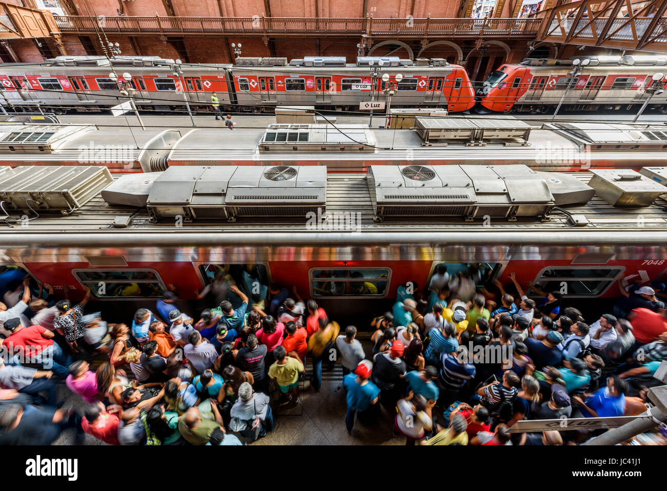 Crowd of people moving into train in EstaÃ§Ã£o da Luz sentral station, SÃ£o Paulo, Brazil Stock Photo