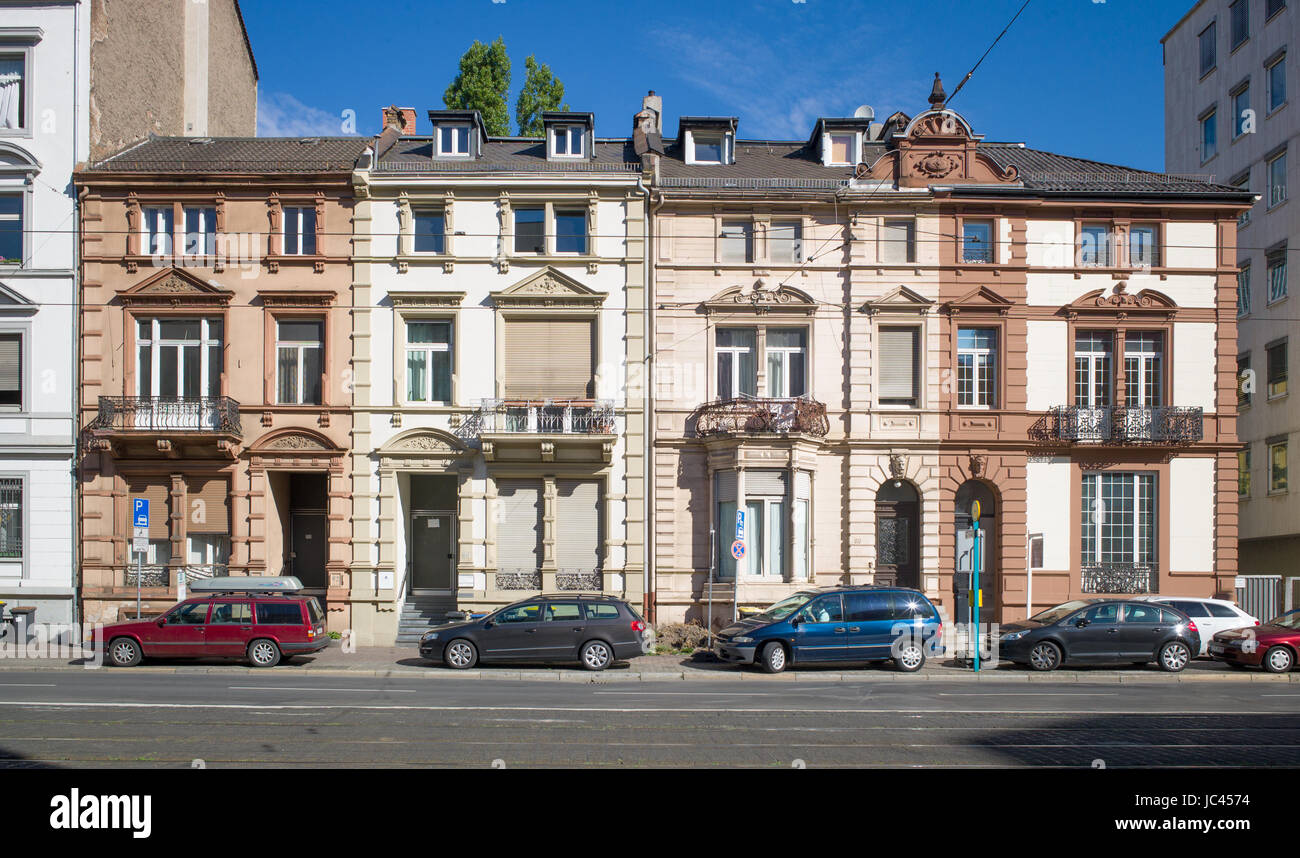 Block Of 4 Terraced Houses With Cars Parked In Front On Pedestrian Stock Photo Alamy
