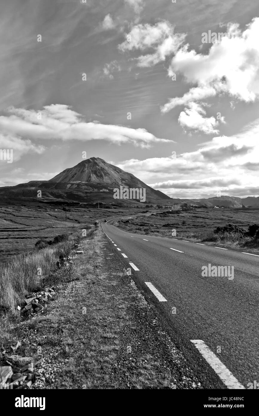 road to the Errigal mountains in black and white at county Donegal Ireland on a bright cloudy day Stock Photo
