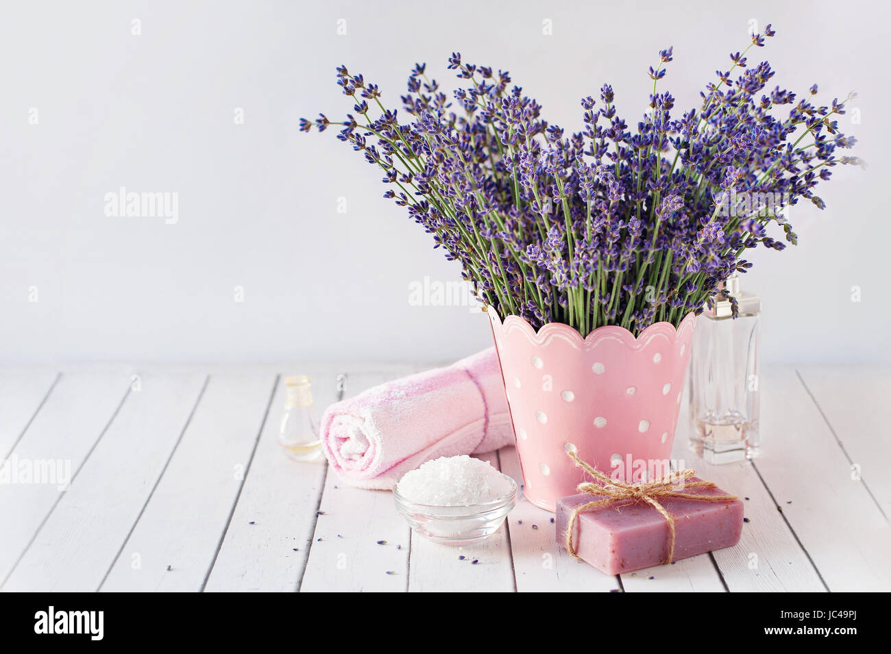 spa massage setting, lavender product, oil on wooden background Stock Photo