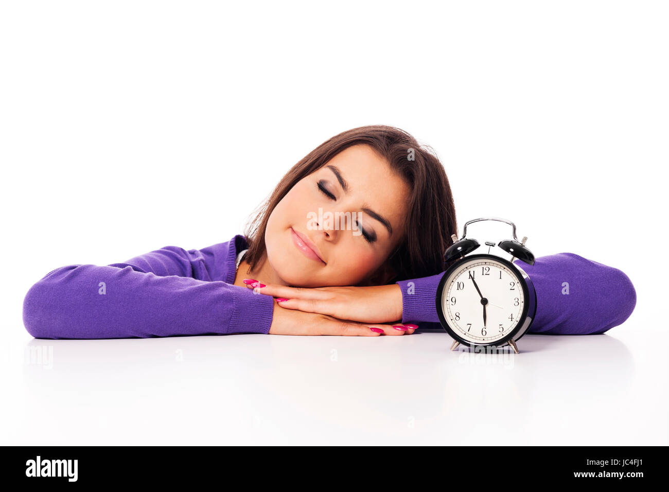 Sleeping beautiful woman with alarm clock Stock Photo - Alamy