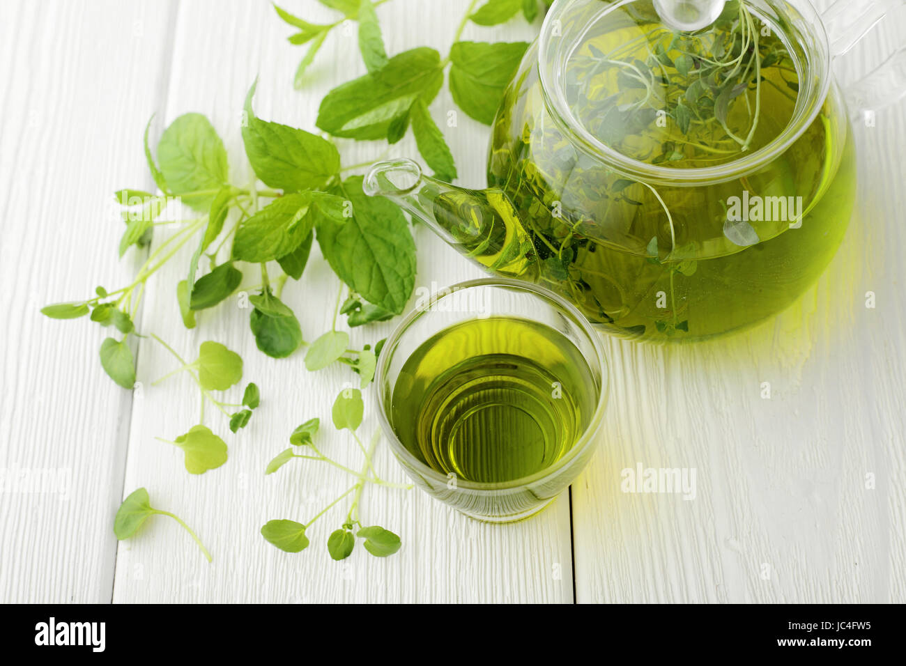 healthy green tea cup with tea leaves Stock Photo Alamy