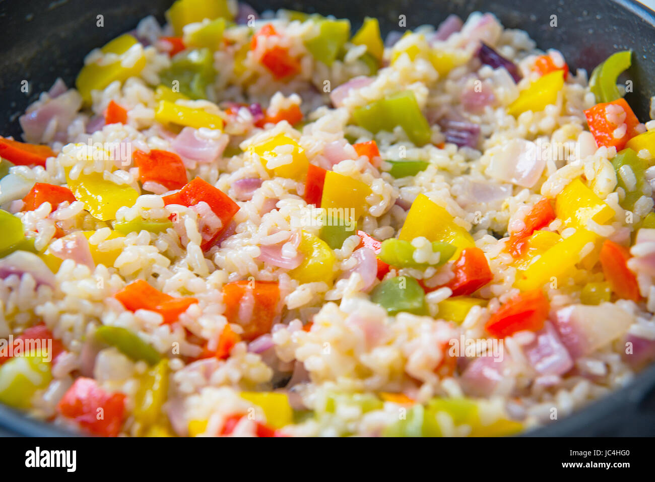 Rice with peppers and onion. Close view Stock Photo Alamy