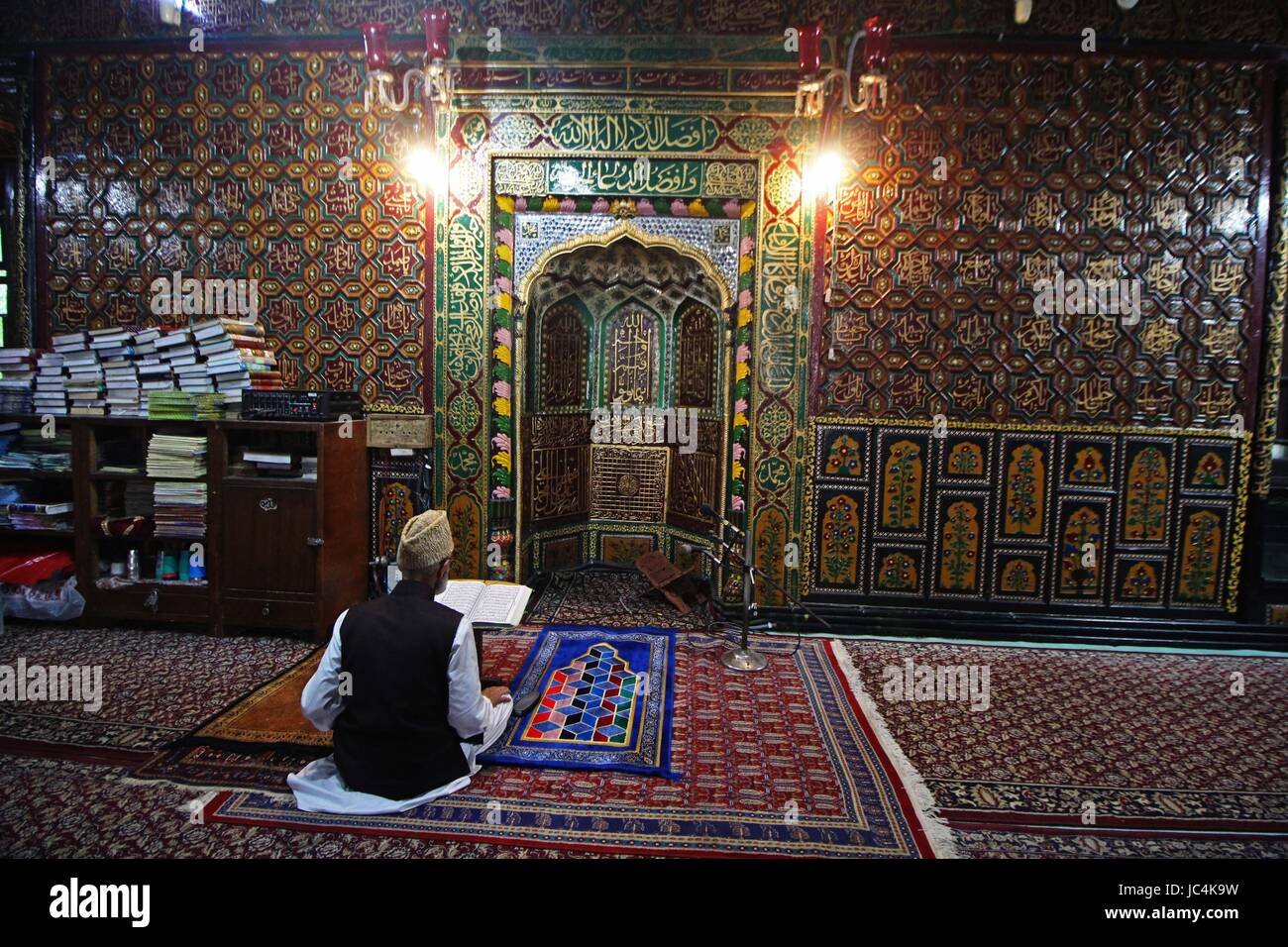 A Kashmiri Muslim man recites the Quran at the Shah-i-Hamdaan shrine ...