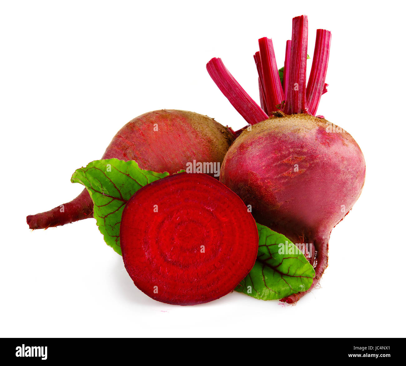 Raw beet vegetables with slice and green leaves isolate on white background Stock Photo