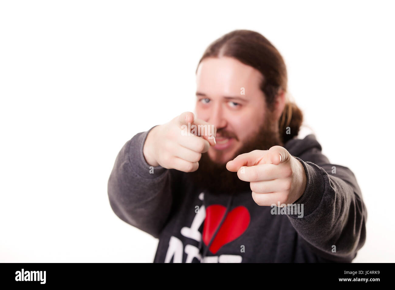 A finger from a person as if you are the next pointing to the straight, blurring background Stock Photo