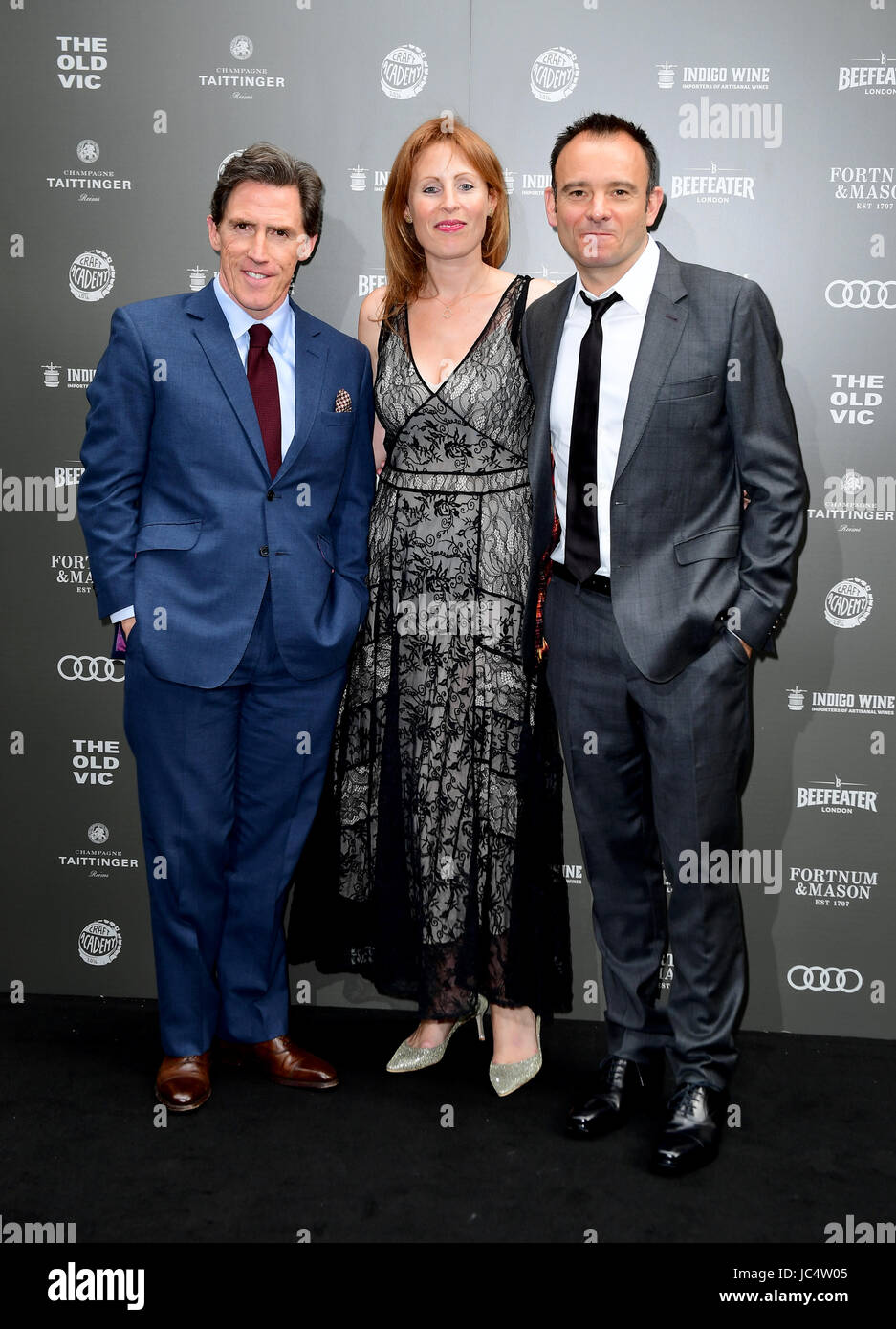 (left to right) Rob Brydon, Kate Varah and Matthew Warchus arriving at the Summer Party 199 for The Old Vic held at The Brewery, London. Stock Photo