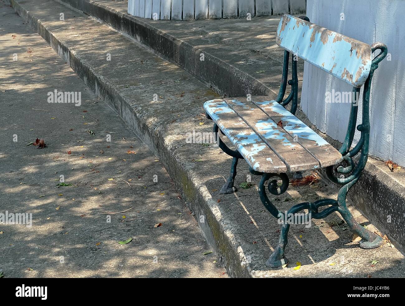 Old Rusty Decorative Blue Wooden Park Bench Standing In The Park