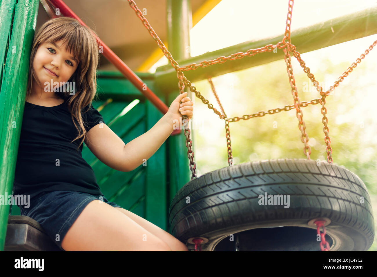 Portrait of happy, little girl on playground Stock Photo - Alamy