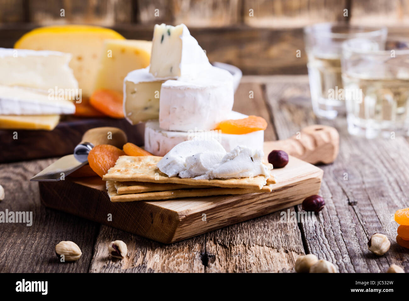 Cheese and wine party table, perfect holiday appetizer on rustic wooden
