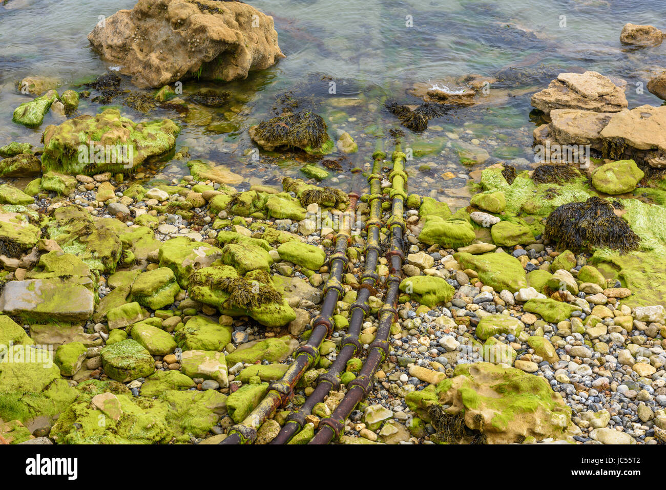 Pipes leading into sea, Seaview, Isle of Wight, UK Stock Photo