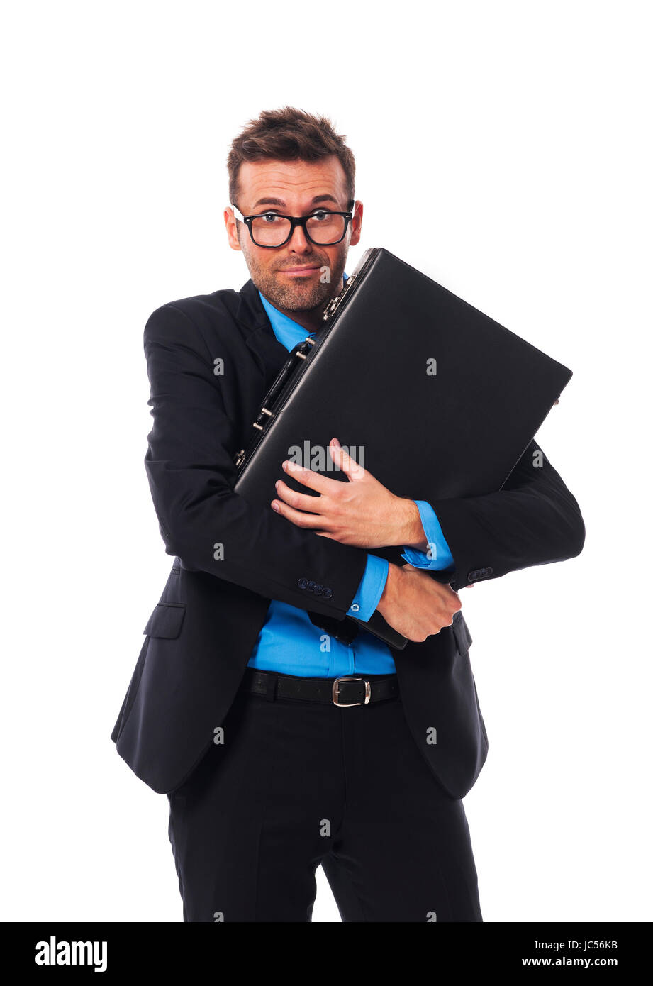 Frightened man firmly clutching his briefcase Stock Photo
