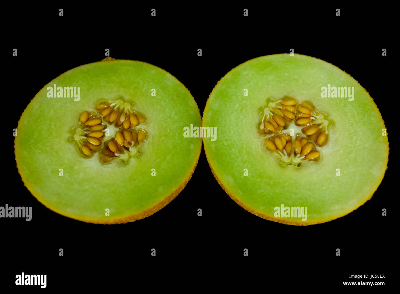 Galia melon whole fruit and cut Stock Photo Alamy