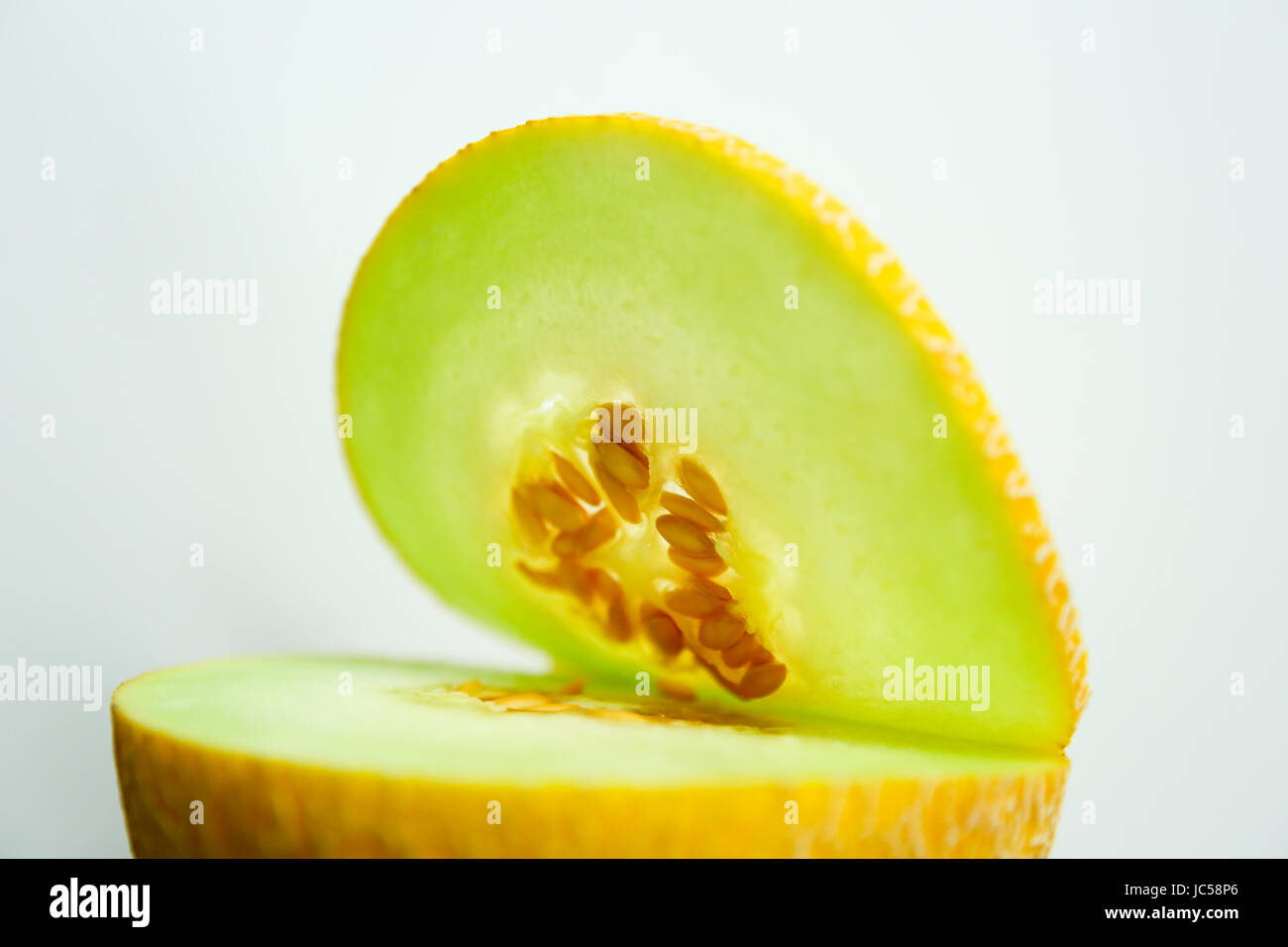 Galia melon whole fruit and cut Stock Photo Alamy