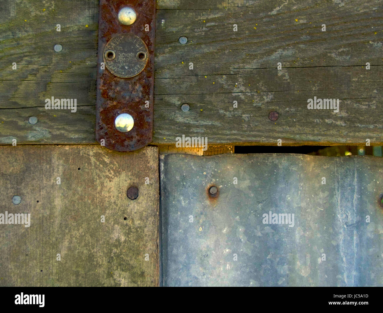 Rusty Hinge on Wood and Corrugated Door with Nails Stock Photo Alamy