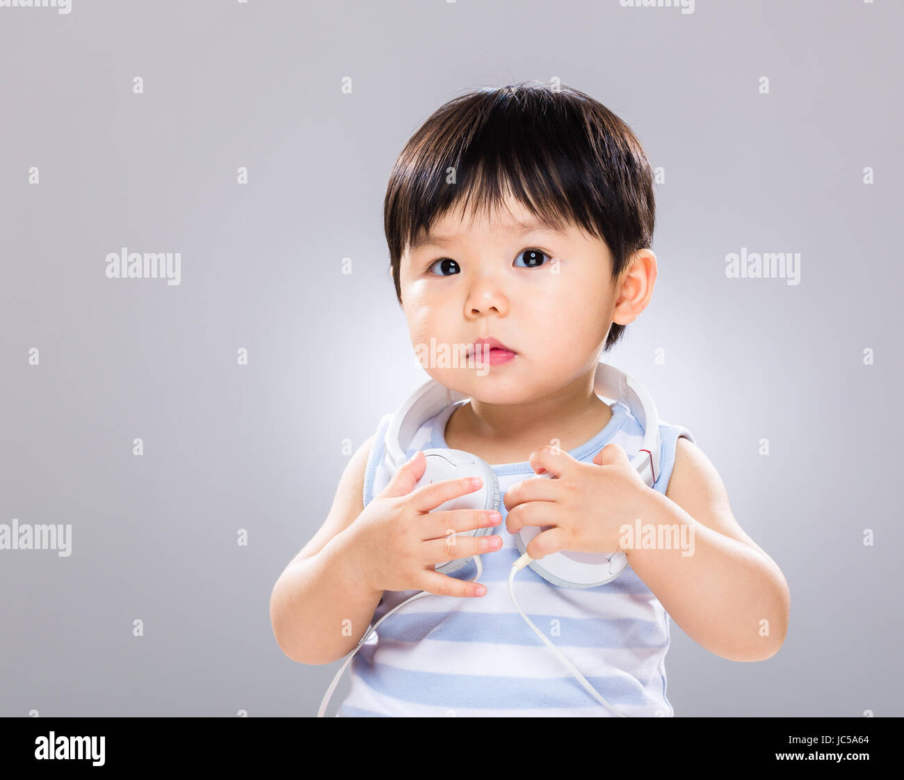 Baby boy love to listen music Stock Photo Alamy