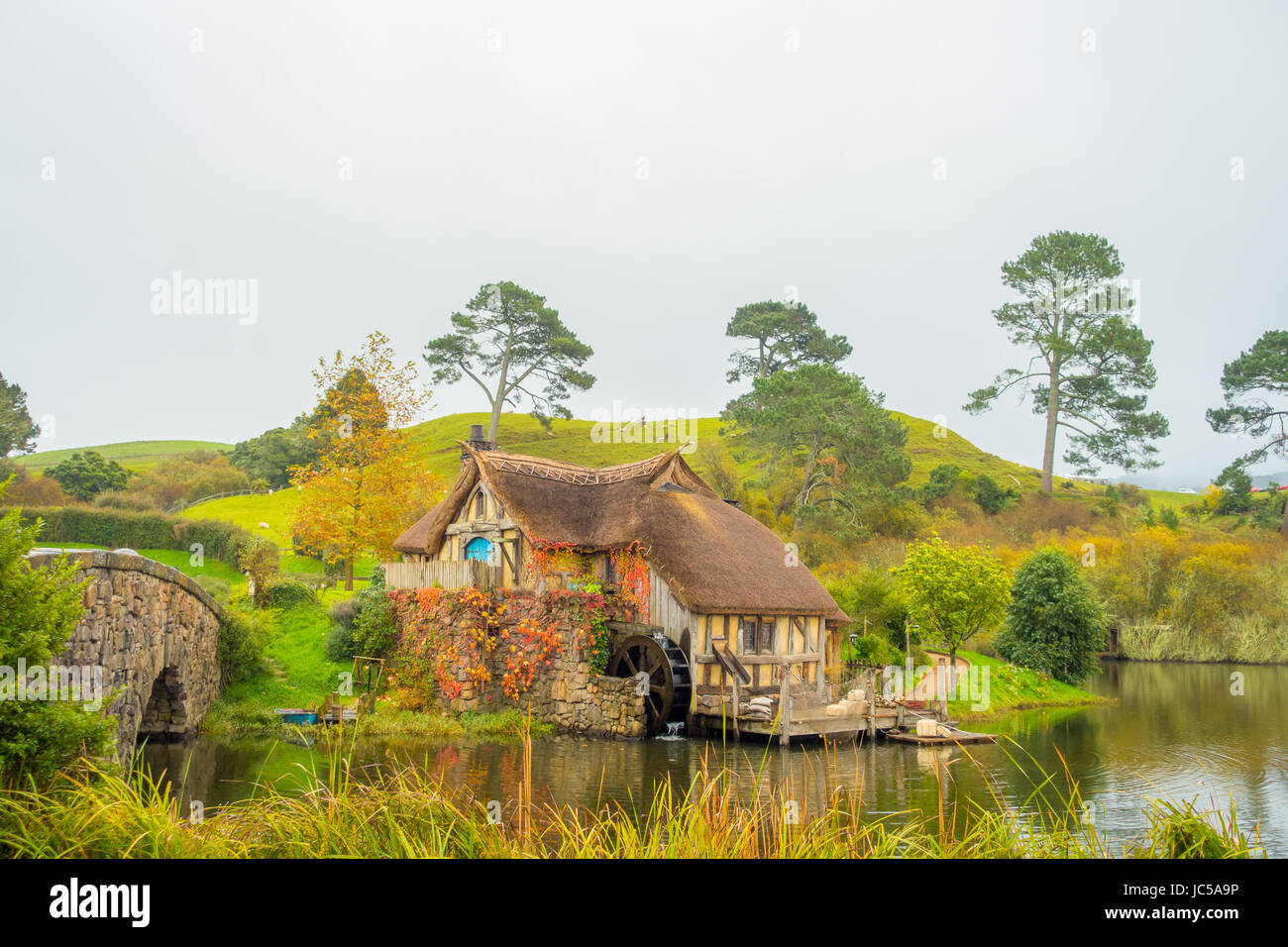 NORTH ISLAND, NEW ZEALAND- MAY 16, 2017: Water mill in Hobbiton, site made for movies: Hobbit and Lord of the ring in Matamata, north island of New Ze Stock Photo