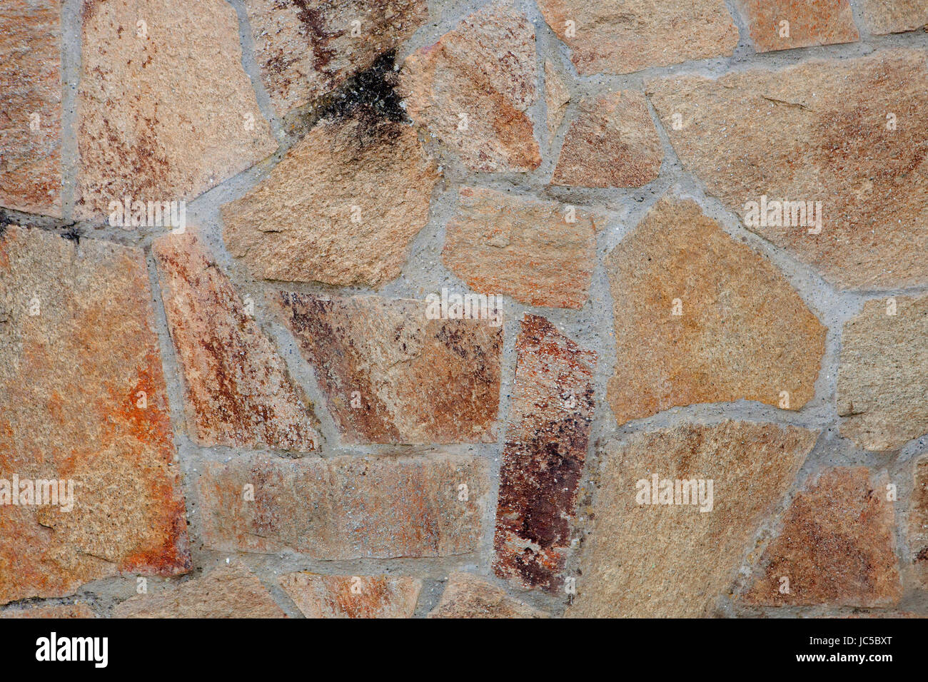 Details of the construction of a stone wall Stock Photo - Alamy