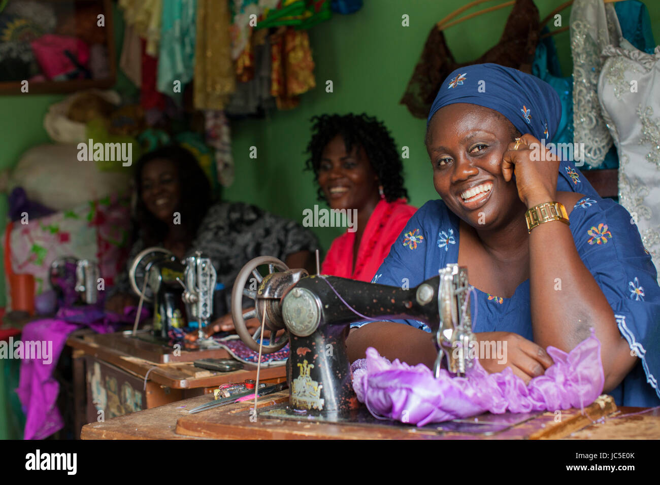 A tailor at her sewing machine, Nigeria, Africa Stock Photo Alamy
