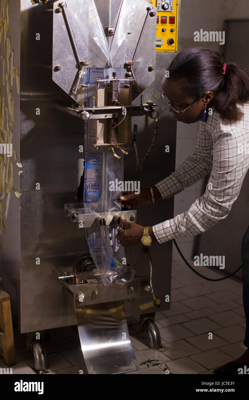 A business woman with her water filters, Nigeria, Africa Stock Photo