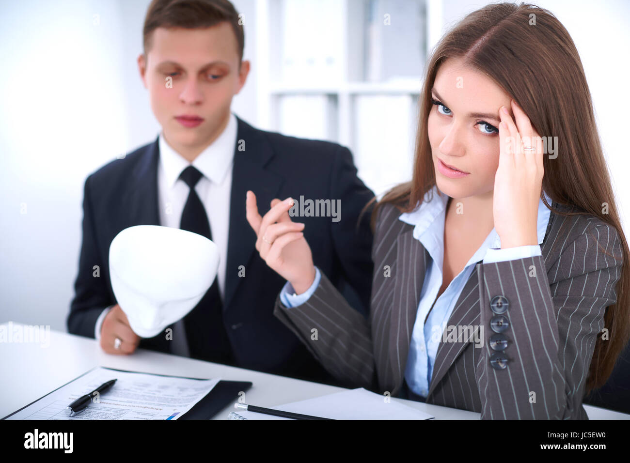 Lacking Understanding Group of business people at a meeting. Negative concept, Lack of ...