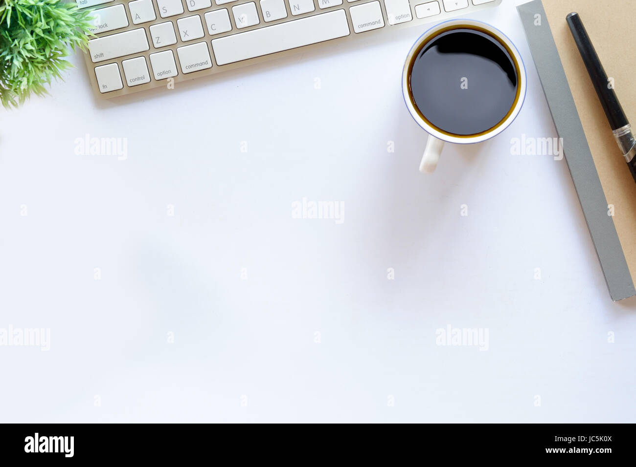 Coffee and white desk table with copy space Stock Photo - Alamy