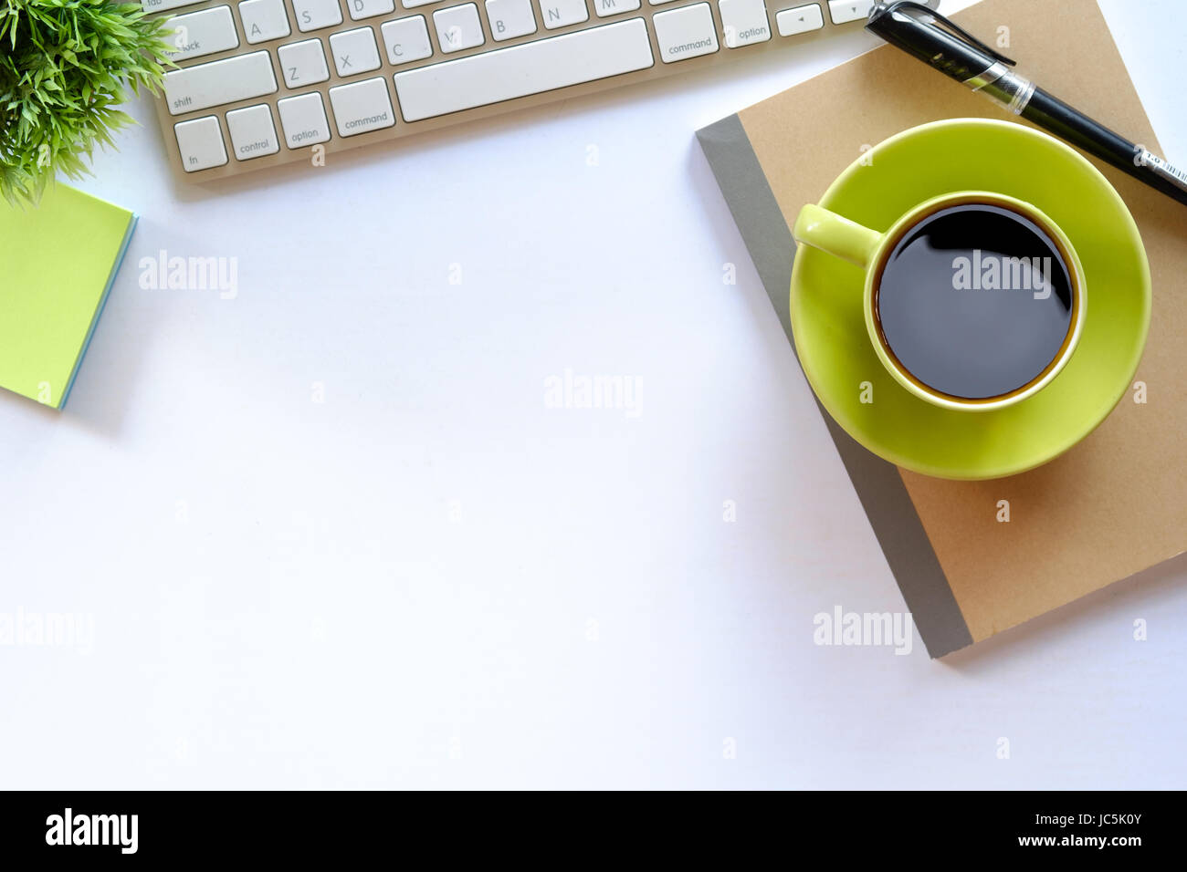 Coffee and white desk table with copy space Stock Photo - Alamy