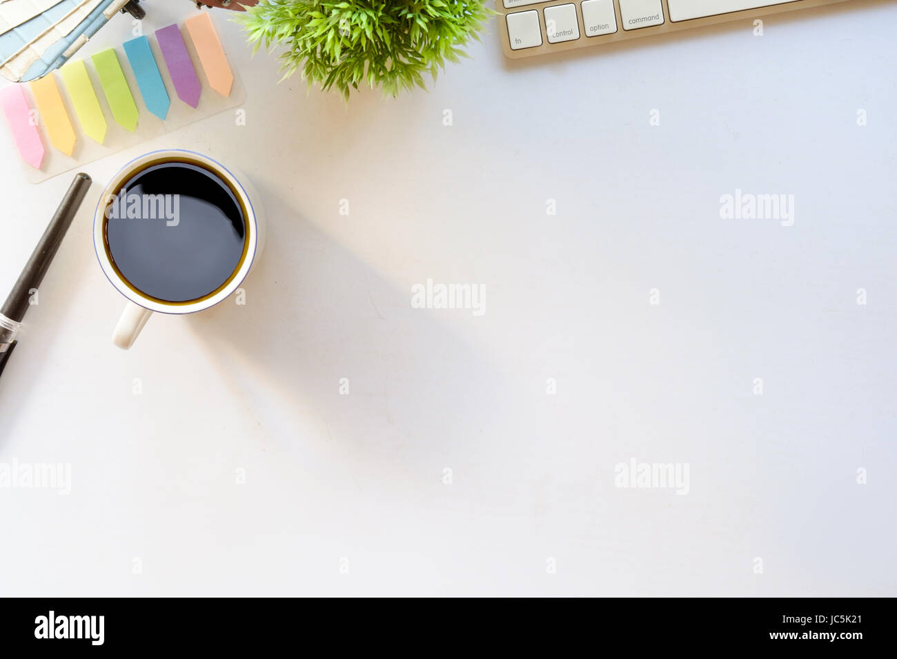 Coffee and white desk table with copy space Stock Photo - Alamy