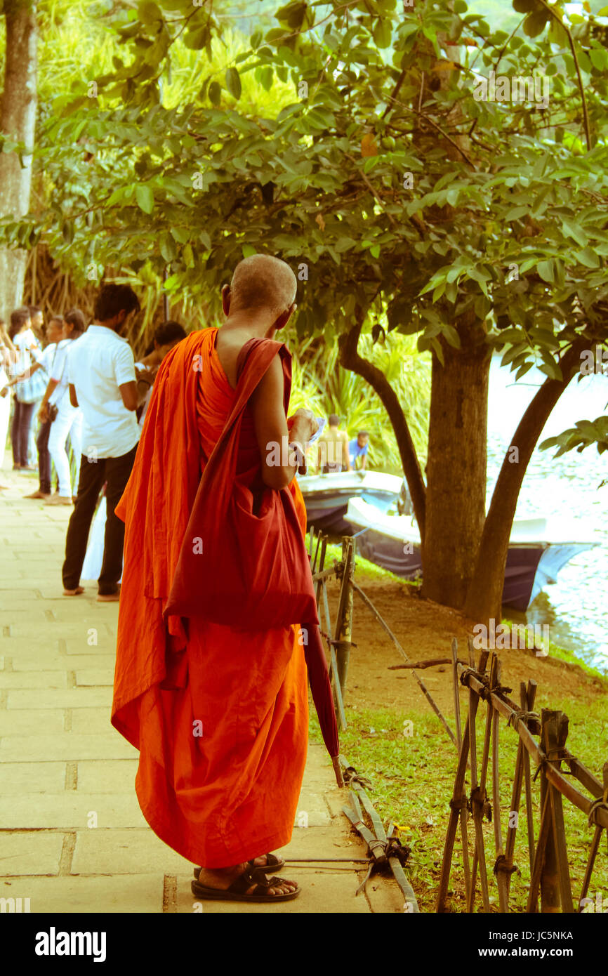 Buddhist Monk visiting temple in Kandy Sri Lanka on Poya day Stock Photo
