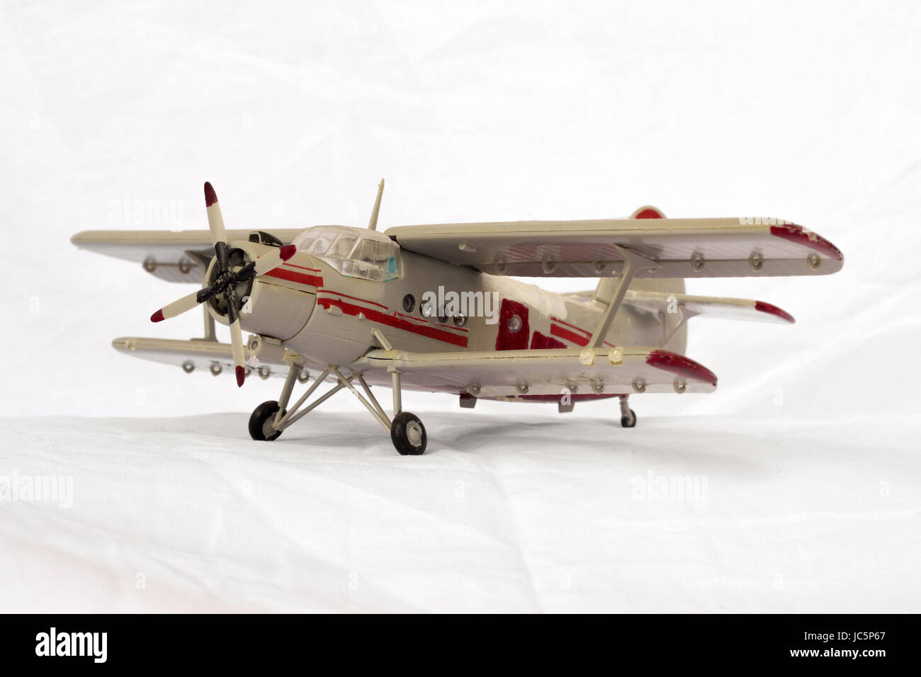 toy model airplane on a white fabric background Stock Photo Alamy