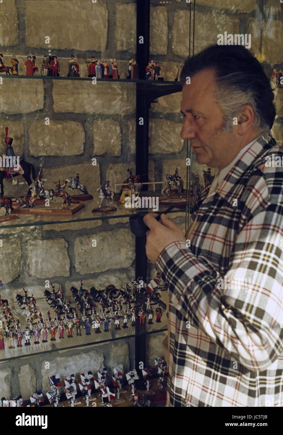 French actor Jean Richard showing his collection of Napoleonian tin soldiers.  c.1969 Photo Michael Holtz Stock Photo