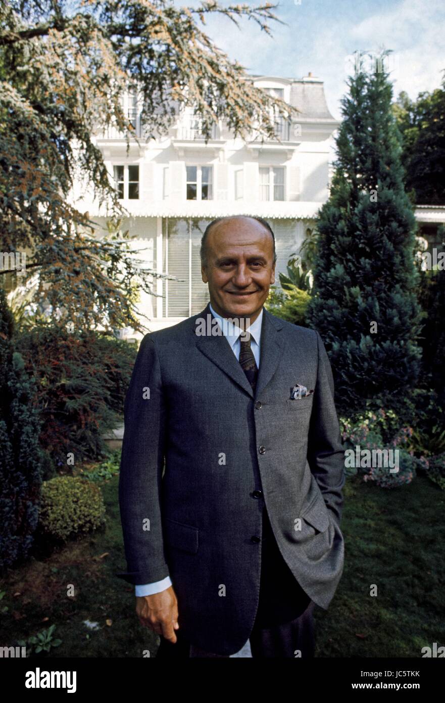 French fashion designer Pierre Balmain posing in front of his house located  32 quai de l'Ecluse in Croissy-sur-Seine, near Paris. September 1968 Photo  Michael Holtz Stock Photo - Alamy