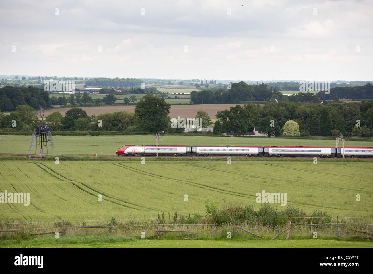 A Virgin High Speed Train passing through countryside near Grendon North Warwickshire Stock Photo