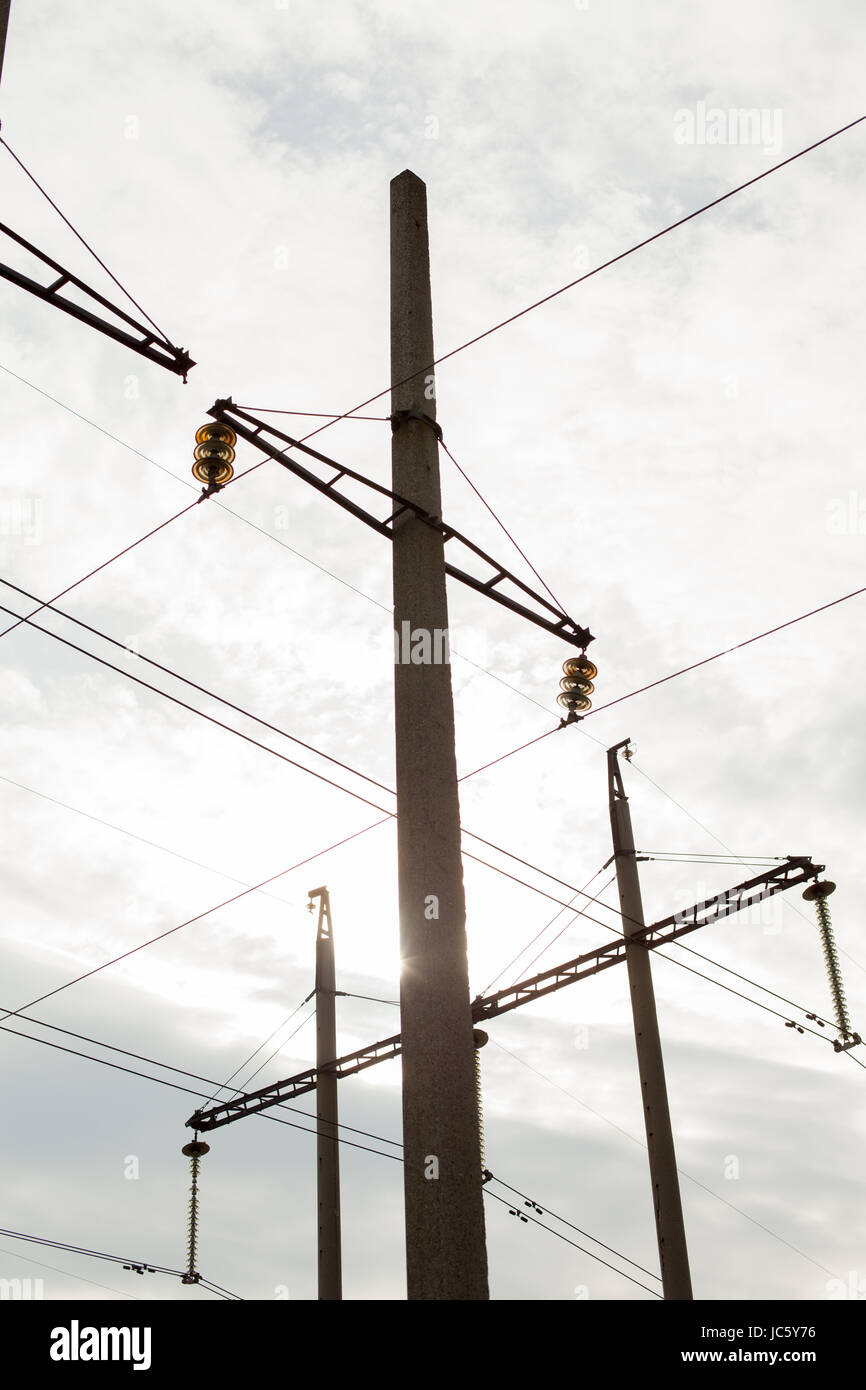 High Voltage Electric Tower. Power concept. With cloud sky and sun
